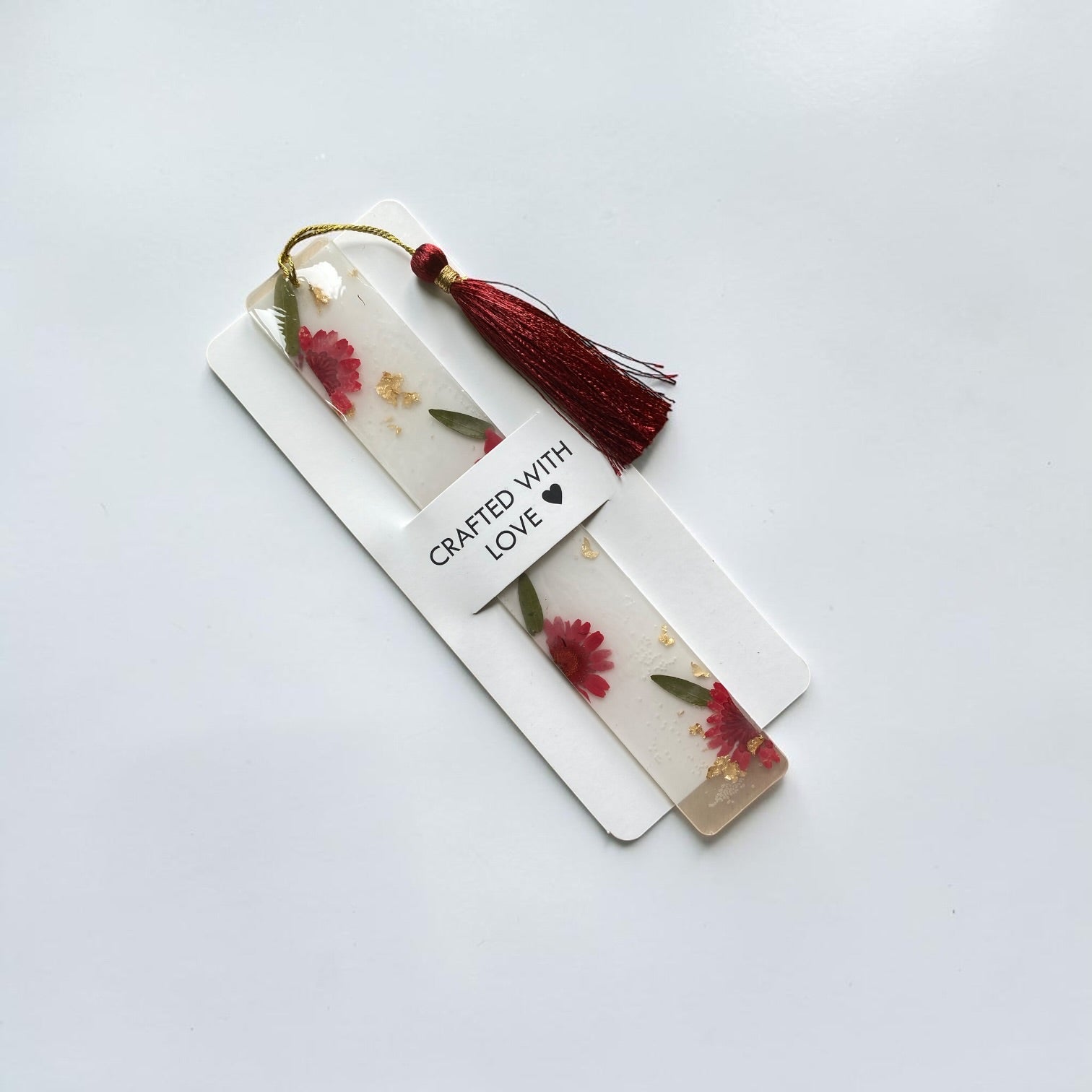 Daisy- fleck -resin- bookmark- with- red- tassel - Resin by Achila