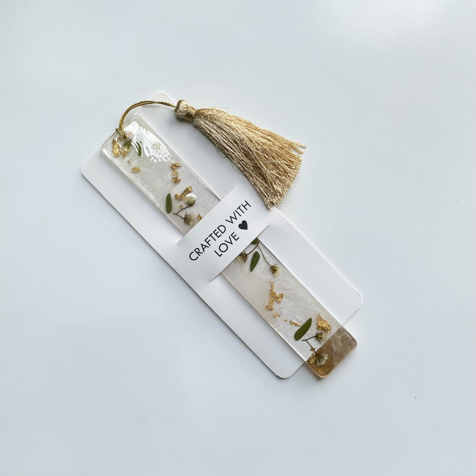 Pressed- tiny- wildflower & green- leaves- resin- bookmark-with- beige- tassel - Resin by Achila